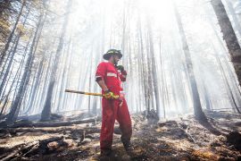 Halifax Regional Fire and Emergency firefighter Zach Rafuse works to put out fires in the Tantallon area of Nova Scotia, one of Canada&#39;s eastern provinces [Nova Scotia Government/AFP]