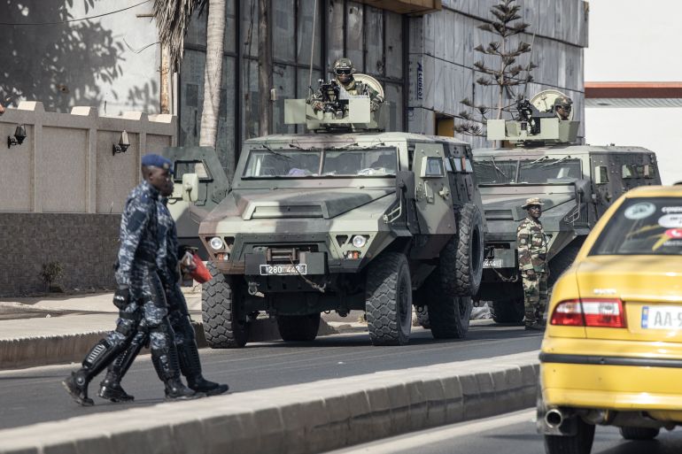 Members of the Senegalese Armed Forces patrol the streets in Dakar,