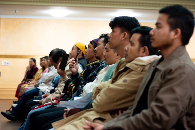 Members of Myanmar's ethnic communities at a community event held by the NUG, Some are in traditional clothing.