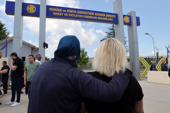 Relatives wait outside factory in Ankara after explosion