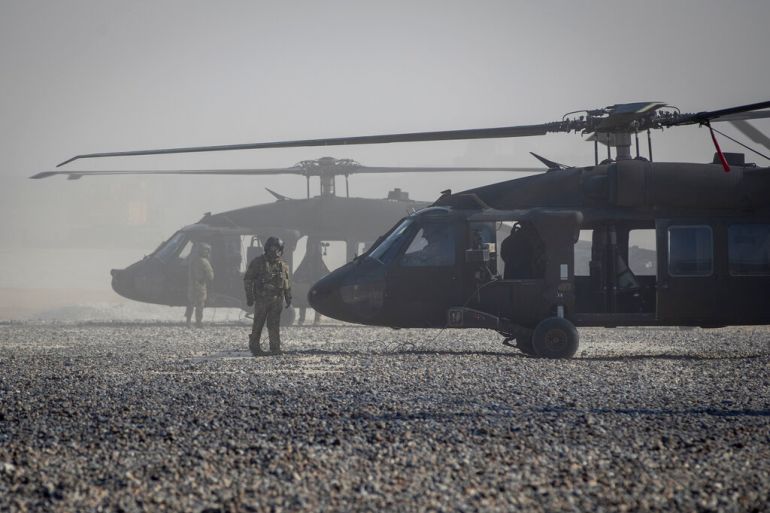 Blackhawk helicopters are parked at a U.S. military base at undisclosed location in Eastern Syria, Monday, Nov. 11, 2019. A senior U.S. coalition commander said Friday, Nov. 15, the partnership with Syrian Kurdish forces remains strong and focused on fighting the Islamic State group, despite an expanding Turkish incursion on areas of Kurdish control. (AP Photo/Darko Bandic)