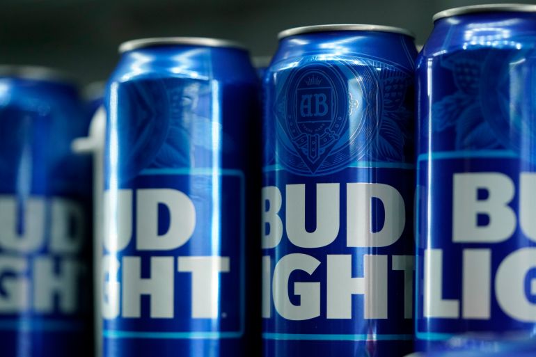 Cans of Bud Light beer are seen before a baseball game