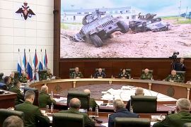 Russian Defense Minister Sergey Shoigu speaks during a meeting with high level officers showing a Ukrainian armored military vehicle in the Belgorod region [Russian Defense Ministry Press Service via AP]