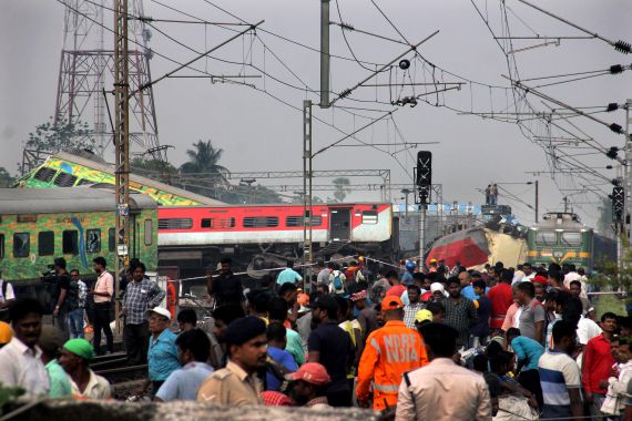 Rescuers work at the site of passenger trains accident, in Balasore district