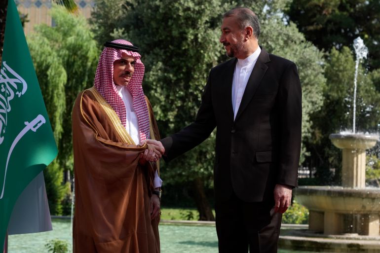 Iranian Foreign Minister Hossein Amirabdollahian, right, and his Saudi counterpart Prince Faisal bin Farhan