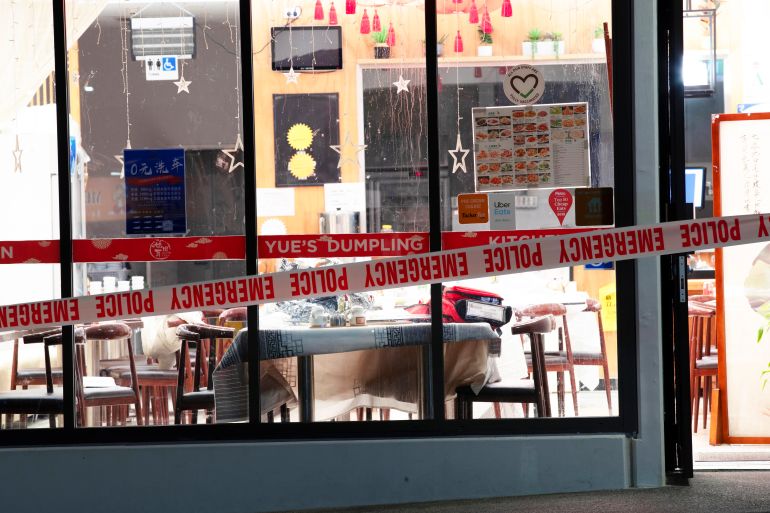 Police tape cordons off a restaurant in Auckland, New Zealand, Tuesday, June 20, 2023, after an axe attack late Monday