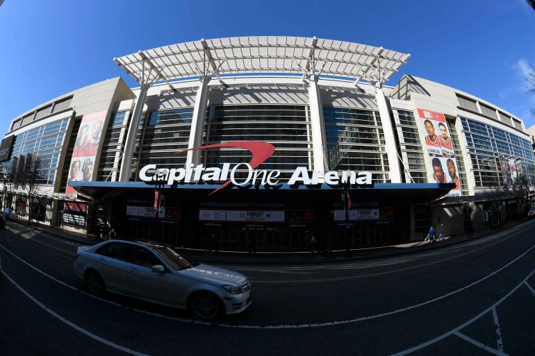 FILE - An exterior view of Capital One Arena is seen Saturday, March 16, 2019, in Washington. Capital One Arena is home to the Washington Capitals NHL hockey team and Washington Wizards NBA basketball team. A person with knowledge of the sale tells The Associated Press the Qatar Investment Authority is buying a 5% stake of the parent company of the NBA's Washington Wizards and NHL's Washington Capitals for $4.05 billion. It is believed to be the first time the government of Qatar is investing in North American professional sports. (AP Photo/Nick Wass)