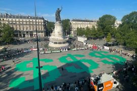 Activists from Avaaz, 350.org, Fridays For Future, Glasgow Actions Team, and more takeover in call for global leaders to end fossil fuel finance in the Place de la Republique on the sidelines of the Global Climate Finance Summit in Paris