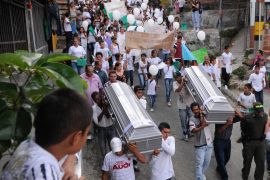 A funeral procession in 2013 files through Medellin, Colombia, after two children were killed amid gang violence in the neighbourhood of Comuna 13 [File: Luis Benavides/AP Photo]