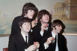 The British rock band the Beatles show their Member of the Order of the British Empire medals at Buckingham Palace in London