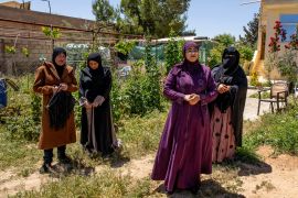 From left to right, Nisreen Al-Eneze, Iman Al-Eneze, Iman Al-Athemat and Jameela Al-Faqeer stand in the local garden they all contribute to