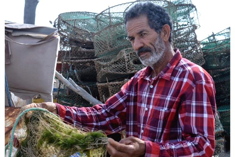 Lakhdar Mahmoud holds a fishing ner