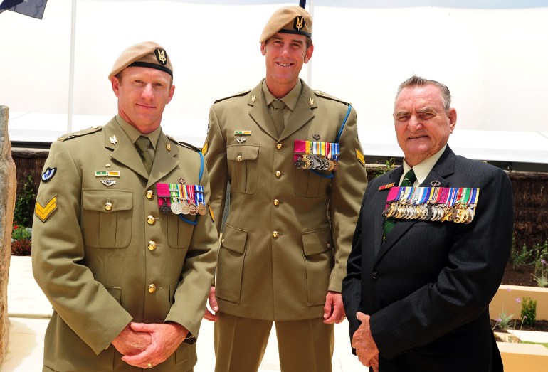 Ben Roberts-Smith with previous recipients of the Victoria Cross. He is in the centre wearing uniform and with medals pinned to his chest