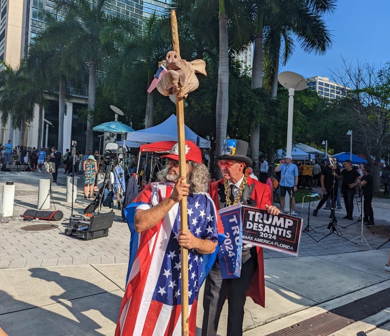 Pro-Trump protester carries a pig's head on a spike outside the federal courthouse 