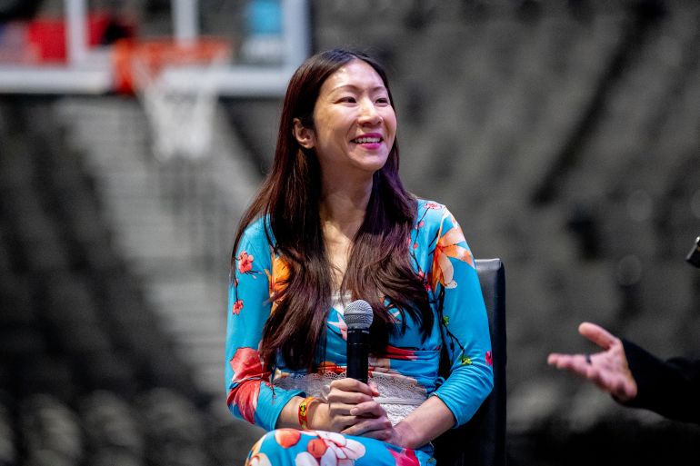 Comedian Jocelyn Chia in New York. She's wearing a colourful outfit and smiling