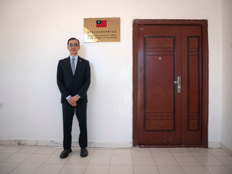 The Taiwan representative outside his office door