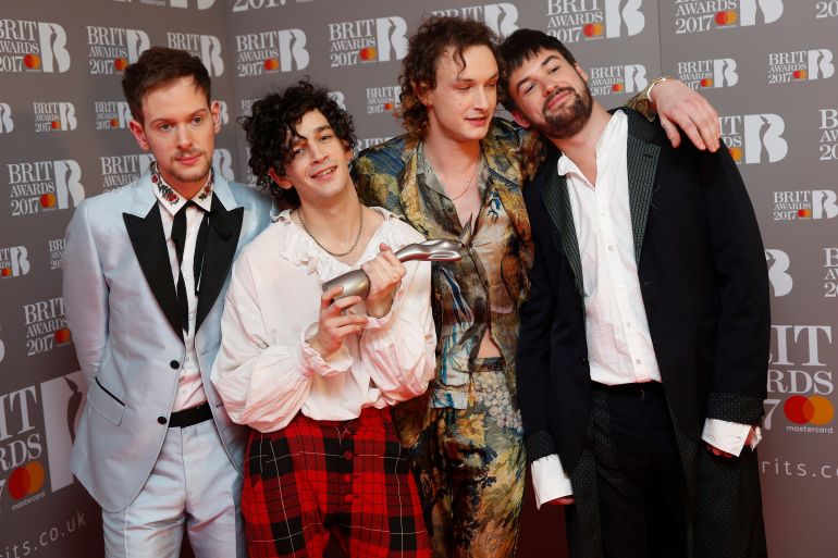 Ross McDonald, Matt Healy, George Daniel and Adam Hann of The 1975 pose with their award for Best British Group at the Brit Awards at the O2 Arena in London, Britain, February 22, 2017.