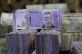 Syrian pounds are pictured inside an exchange currency shop in Azaz, Syria February 3, 2020. Picture taken February 3, 2020. REUTERS/Khalil Ashawi