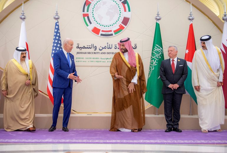 Saudi Crown Prince Mohammed bin Salman and U.S President Joe Biden gesture as they stand for a family photo ahead of the Jeddah Security and Development Summit in Jeddah, Saudi Arabia, July 16, 2022.