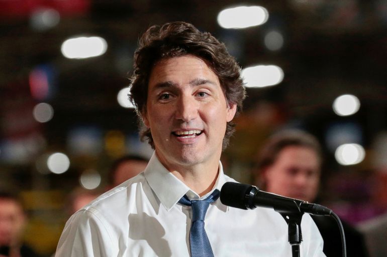 Canadian Prime Minister Justin Trudeau speaks at a microphone