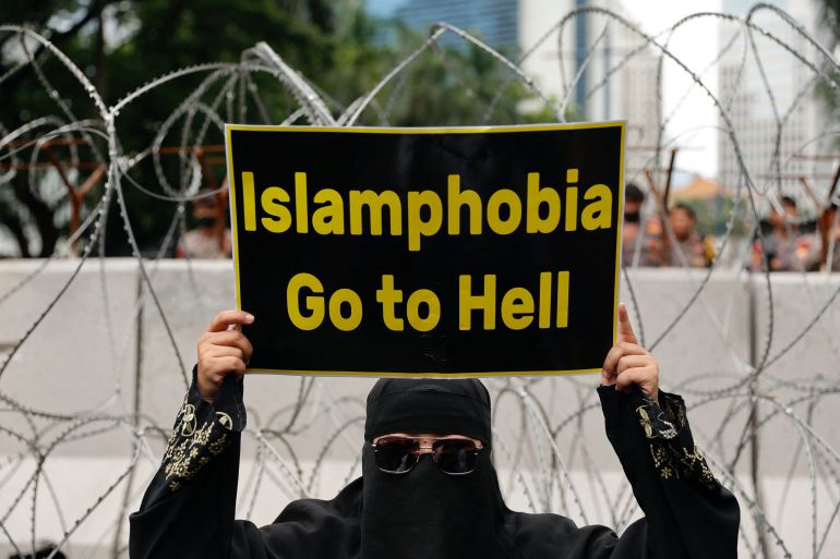 A placard that read 'Islamophobia go to hell'