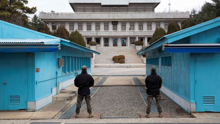 South Korean soldiers stand guard during a media tour at the Joint Security Area (JSA) on the Demilitarized Zone (DMZ) in the border village of Panmunjom in Paju, South Korea