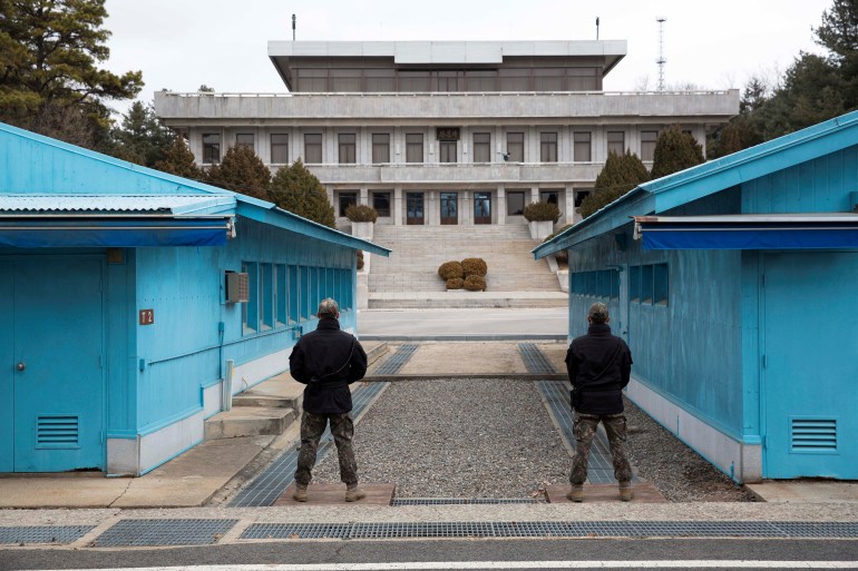 South Korean soldiers stand guard during a media tour at the Joint Security Area (JSA) on the Demilitarized Zone (DMZ) in the border village of Panmunjom in Paju, South Korea