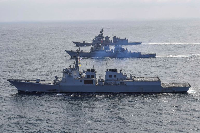 South Korean Navy's destroyer Yulgok Yi I, the US Navy's destroyer USS Benfold and Japan Maritime Self-Defense Force's destroyer Atago take part in joint naval missile defense exercises in international waters between Korea and Japan, April 17, 2023.