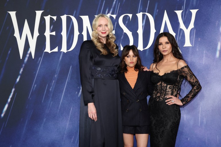 Cast members Gwendoline Christie, Jenna Ortega and Catherine Zeta-Jones attend a photo call for the television series "Wednesday" at Hollywood Forever Cemetery in Los Angeles