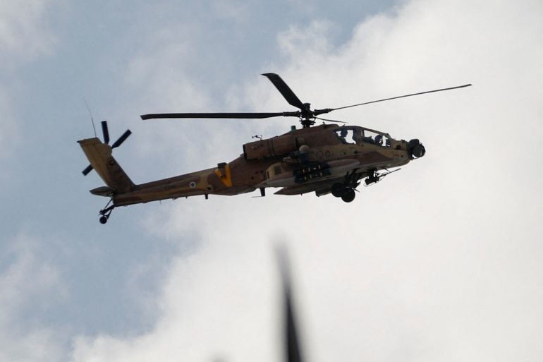 An Israeli helicopter flies during an Israeli raid in Jenin, in the Israeli-occupied West Bank June 19, 2023. REUTERS/Raneen Sawafta
