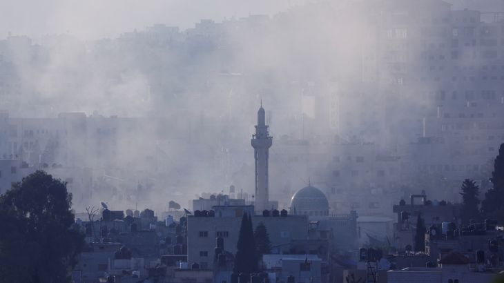 Smoke rises during an Israeli military raid