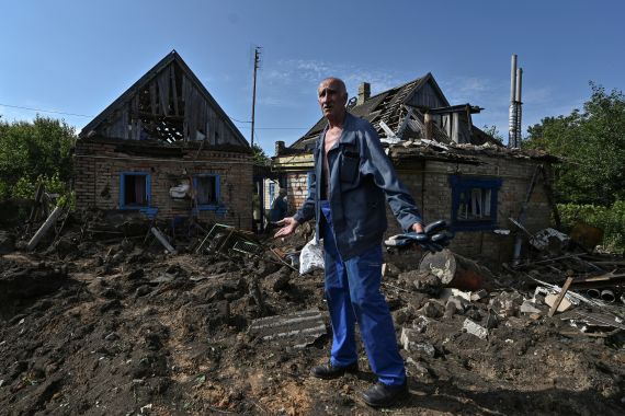 Local resident Volodymyr Bokii, 69-year-old, stands next to his house damaged by a Russian ballistic missile strike, amid Russia's attack on Ukraine, in the town of Kushuhum, Zaporizhzhia region, Ukraine July 3, 2023
