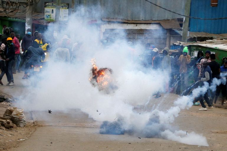 A teargas canister, lobbed by riot police officers to disperse protesters, explodes as supporters of Kenya's opposition leader Raila Odinga participate in anti-government protests