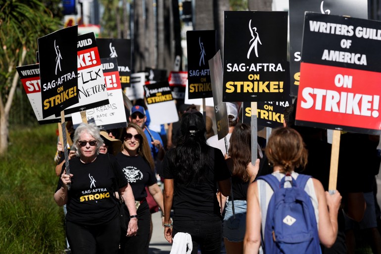 SAG-AFTRA actors strike against the Hollywood studios as they join the Writers Guild of America