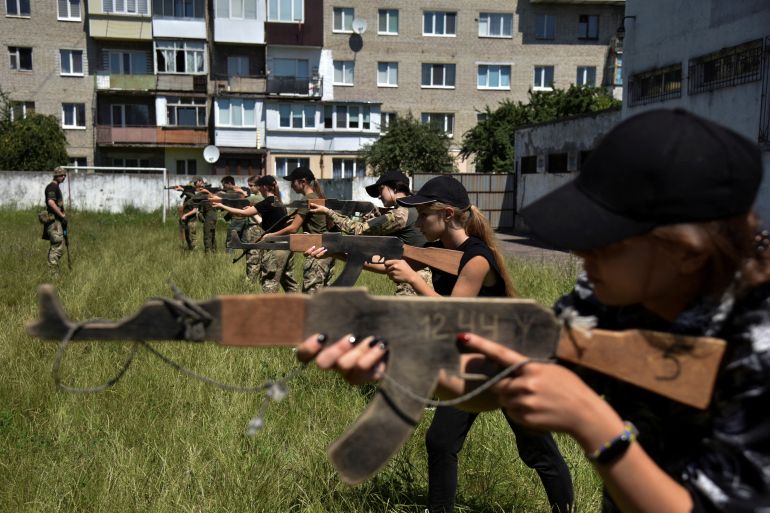 Teenagers attend a military training conducted by members of the Ukrainian Volunteer Corps, amid Russia's attack of Ukraine, in Lviv region, Ukraine July 16, 2023
