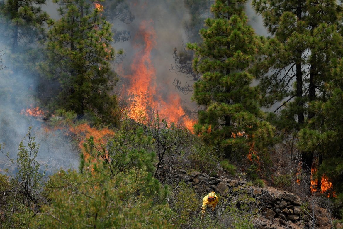 Forest firefighters work during the Tijarafe forest fire on the Canary Island of La Palma, Spain