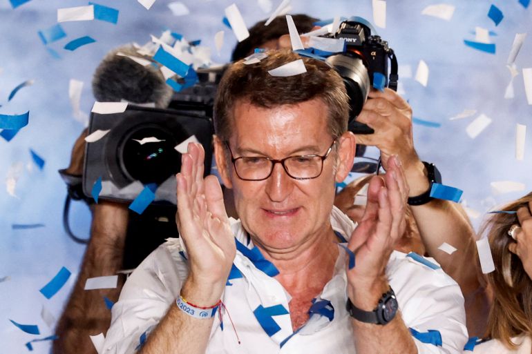 Spain's opposition People's Party leader Alberto Nunez Feijoo applauds during the general election, in Madrid, Spain, July 24, 2023.