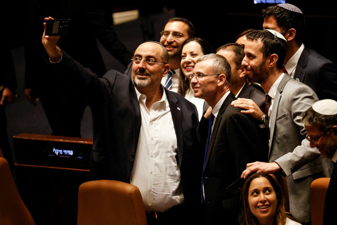 Israeli lawmakers take a selfie in the Knesset plenum following a vote