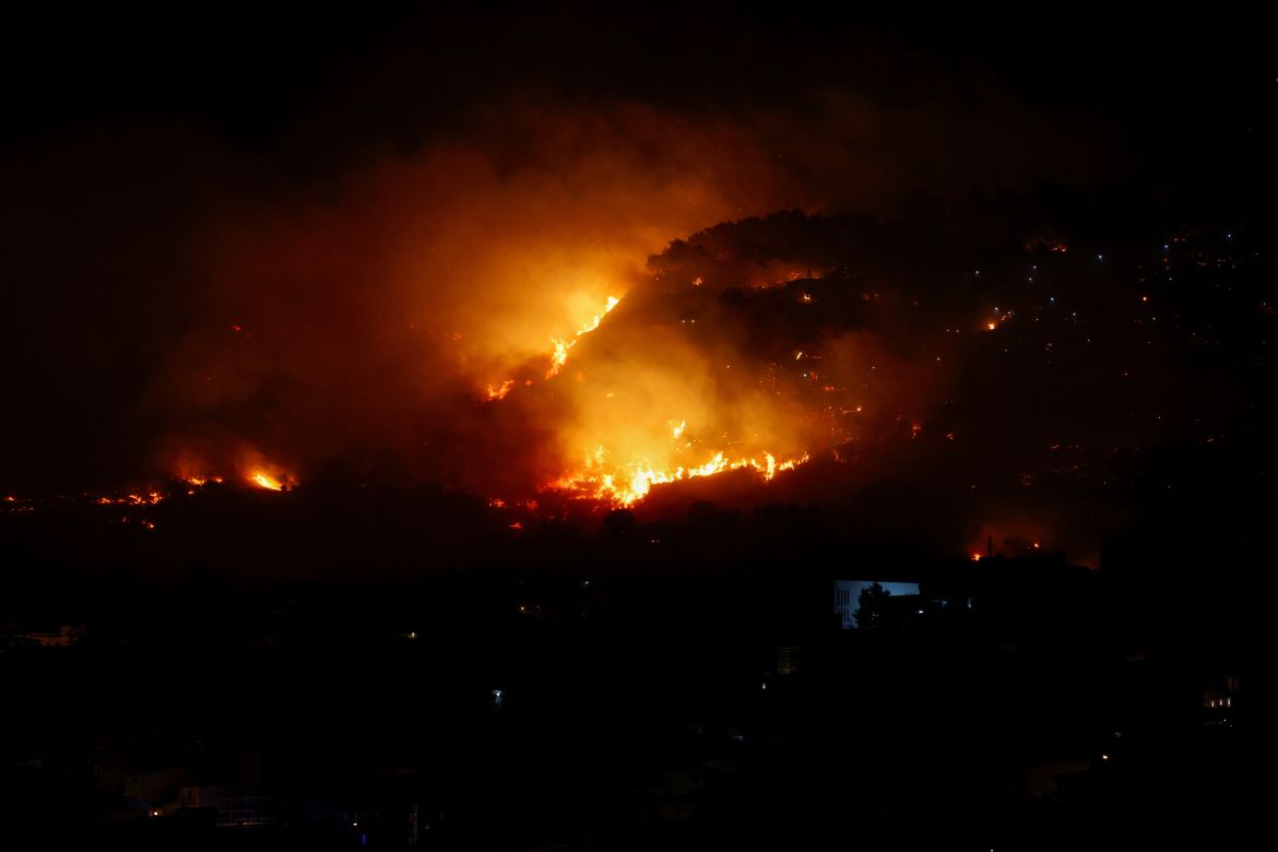 A wildfire burns in the Sicilian village of Romitello