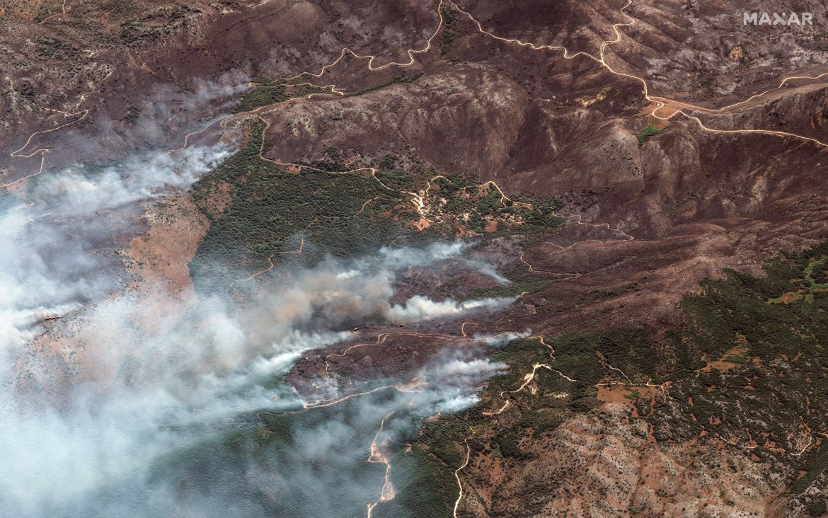 A satellite image shows overview as a wildfire burns on the island of Corfu, Greece