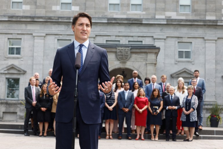 Justin Trudeau stands in front of his new cabinet