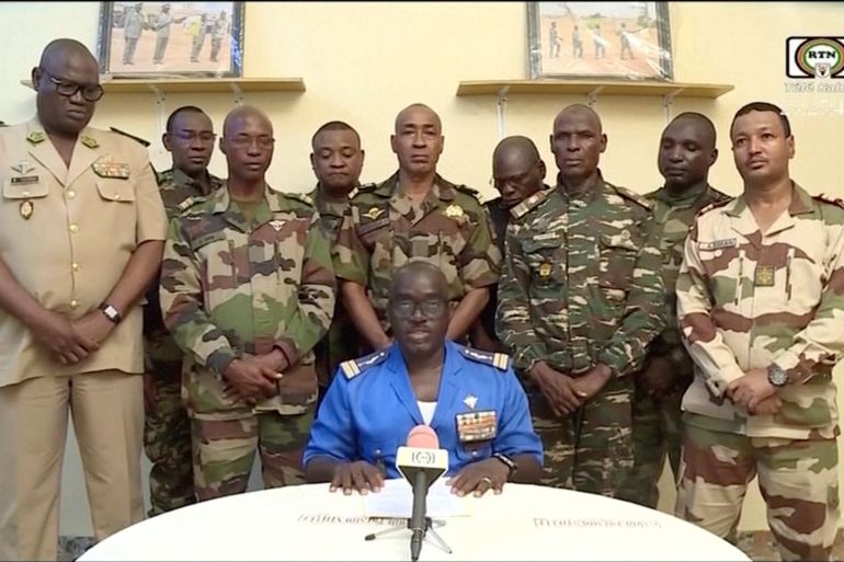 Niger Army spokesman Colonel Major Amadou Adramane speaks during an appearance on national television, after President Mohamed Bazoum was held in the presidential palace, in Niamey, Niger, July 26, 2023 in this still image taken from video.