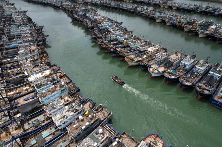 Fishing boats are seen moored at Gaoqi fishing port as typhoon Doksuri approaches, in Xiamen, Fujian province, China July 26, 2023. cnsphoto via REUTERS ATTENTION EDITORS - THIS IMAGE WAS PROVIDED BY A THIRD PARTY. CHINA OUT.