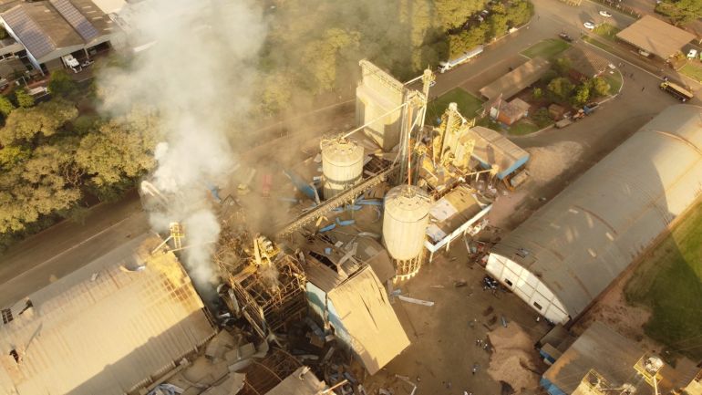 White smoke is seen at the site of a deadly grain silo explosion in Brazil