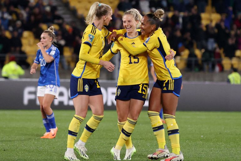 Sweden's Rebecka Blomqvist celebrates scoring their fifth goal with Madelen Janogy and Sofia Jakobsson