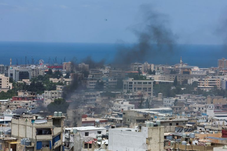 Smoke rises from Ain el-Hilweh Palestinian refugee camp during Palestinian faction clashes