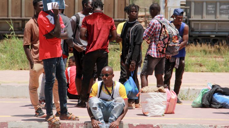 African migrants wait for a train at the railway station on July 5, 2023, as they flee to Tunis amid unrest in Sfax