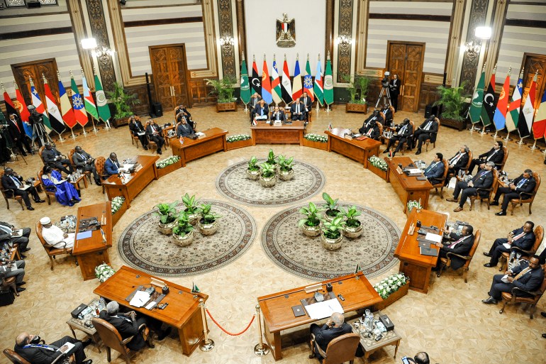 This handout picture released by the Egyptian Presidency shows Egypt's President Abdel Fattah al-Sisi attending a regional summit for neighbouring nations impacted by the three-month war between Sudan's rival generals at the presidential palace in Cairo on July 13, 2023, with leaders from Ethiopia, Eritrea, Chad, South Sudan, the Central African Republic, and Libya, and the heads of the African Union and the Arab League. - Reading out a joint statement at the end of the summit on July 13, Sisi called on the international community "to honour the commitments" it had made in June, when international donors pledged $1.5 billion in aid -- less than half the estimated needs for Sudan and its affected neighbours. (Photo by - / EGYPTIAN PRESIDENCY / AFP) / === RESTRICTED TO EDITORIAL USE - MANDATORY CREDIT "AFP PHOTO / HO / EGYPTIAN PRESIDENCY' - NO MARKETING NO ADVERTISING CAMPAIGNS - DISTRIBUTED AS A SERVICE TO CLIENTS == - === RESTRICTED TO EDITORIAL USE - MANDATORY CREDIT "AFP PHOTO / HO / EGYPTIAN PRESIDENCY' - NO MARKETING NO ADVERTISING CAMPAIGNS - DISTRIBUTED AS A SERVICE TO CLIENTS == /