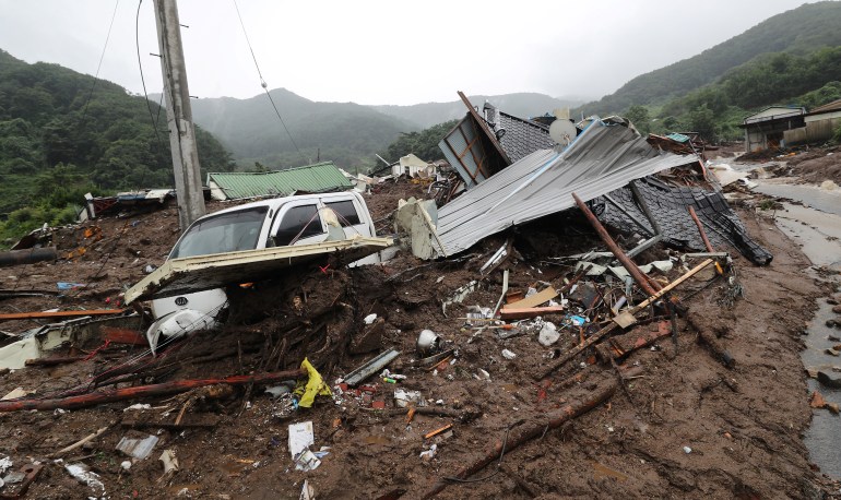 A damaged house is seen after a landslide hit a small village in Yecheon on July 15, 2023. - Seven people have been killed and three were missing as heavy rains flooded South Korea, officials said on July 15, with thousands told to evacuate their homes due to an overflowing dam. (Photo by - / YONHAP / AFP) / - South Korea OUT / NO USE AFTER AUGUST 14, 2023 15:00:00 GMT - - SOUTH KOREA OUT / REPUBLIC OF KOREA OUT NO ARCHIVES RESTRICTED TO SUBSCRIPTION USE - REPUBLIC OF KOREA OUT NO ARCHIVES RESTRICTED TO SUBSCRIPTION USE
