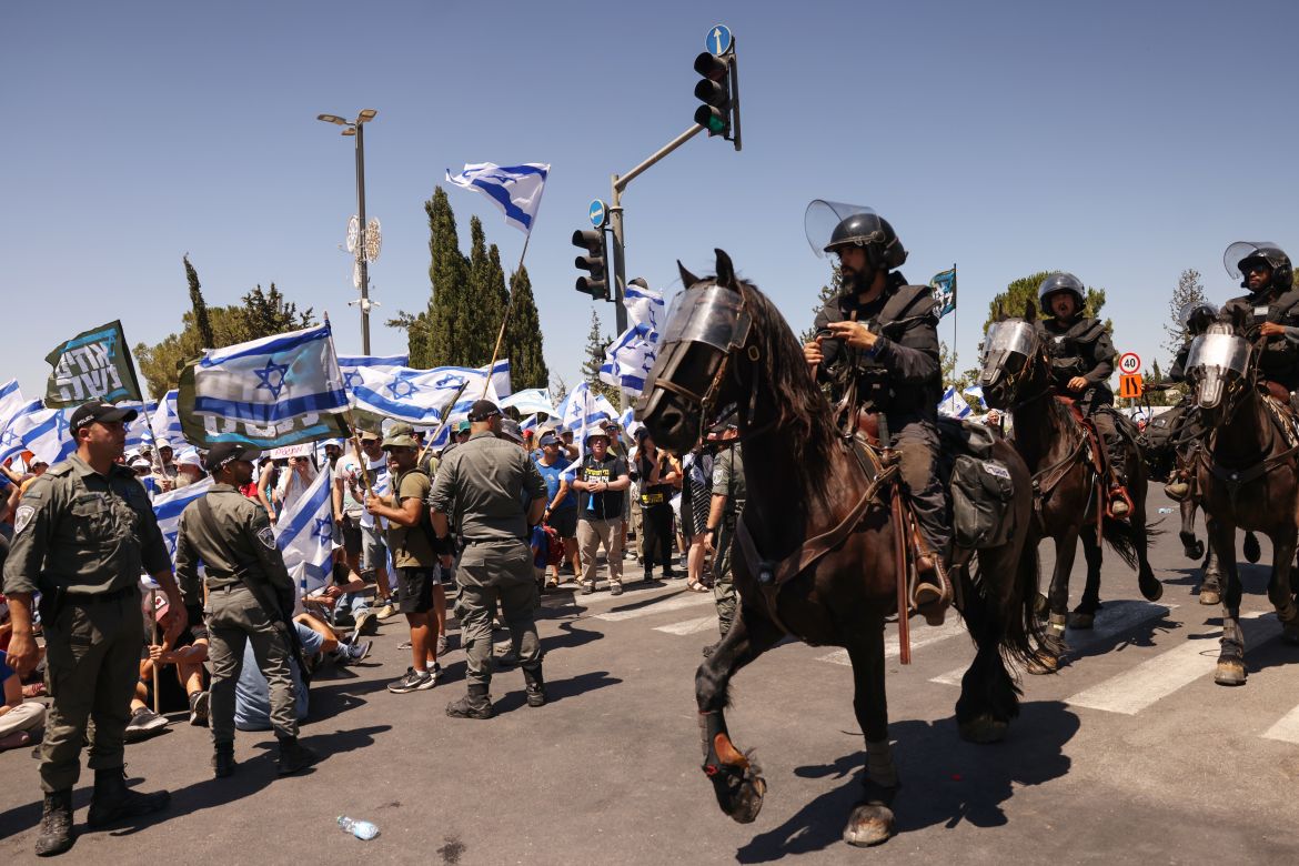 Members of Israel's mounted security forces arrive at the site of a demonstration